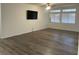 Living room with new luxury vinyl plank flooring, neutral paint, and recessed lighting at 1785 Puerto Way, Henderson, NV 89012