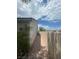 Exterior side yard has gravel ground and a privacy wall at 1785 Puerto Way, Henderson, NV 89012