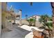 The backyard patio features a unique spiral staircase and mature landscaping at 2388 Kenneth Ave, Henderson, NV 89052