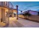 Exterior patio features a spiral staircase and a peek at the pool at 2388 Kenneth Ave, Henderson, NV 89052