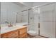 Bathroom featuring a vanity with sink, a mirror, a toilet, and a glass-enclosed shower at 2388 Kenneth Ave, Henderson, NV 89052