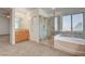 Bathroom includes a shower with glass doors and a luxurious bathtub, surrounded by neutral carpet at 2388 Kenneth Ave, Henderson, NV 89052