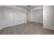 Neutral carpeted bedroom with a closet offering plenty of storage at 2388 Kenneth Ave, Henderson, NV 89052