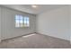 Neutral carpeted bedroom with a window offering natural light at 2388 Kenneth Ave, Henderson, NV 89052