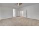 Bonus room with neutral carpet, ceiling fan, and multiple interior doors leading to other rooms at 2388 Kenneth Ave, Henderson, NV 89052