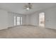 Bonus room with carpet and a ceiling fan with patio door access at 2388 Kenneth Ave, Henderson, NV 89052