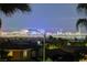 Las Vegas city lights at night illuminate this home's breathtaking panorama with desert landscaping at 2388 Kenneth Ave, Henderson, NV 89052