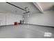 Spacious two car garage with painted walls and concrete flooring at 2388 Kenneth Ave, Henderson, NV 89052