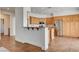 Functional kitchen featuring a breakfast bar, stainless steel appliances and wood cabinets at 2388 Kenneth Ave, Henderson, NV 89052