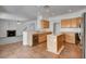 Open concept kitchen featuring stainless steel appliances and seamless transition to the living room at 2388 Kenneth Ave, Henderson, NV 89052