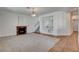 Comfortable living room featuring fireplace, built-in shelving and seamless transition to the hallway at 2388 Kenneth Ave, Henderson, NV 89052