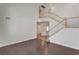 Inviting living room featuring wood floors, staircase, and neutral paint at 2388 Kenneth Ave, Henderson, NV 89052