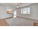 Spacious living room with plush carpeting and a large window offering ample natural light at 2388 Kenneth Ave, Henderson, NV 89052
