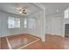 Open living room featuring tile flooring, neutral paint, ceiling fan, and abundant natural light at 2388 Kenneth Ave, Henderson, NV 89052