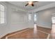 Spacious living room featuring neutral walls, tile flooring, and arched openings at 2388 Kenneth Ave, Henderson, NV 89052