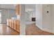Open-concept living room and kitchen space with a fireplace and updated appliances at 2388 Kenneth Ave, Henderson, NV 89052