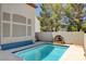 Private pool with a water feature, surrounded by desert landscaping at 2388 Kenneth Ave, Henderson, NV 89052
