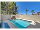 Inviting pool with a stone fountain feature in a private backyard at 2388 Kenneth Ave, Henderson, NV 89052