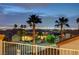 Charming street lined with palm trees and well-maintained homes, offering serene views of the Las Vegas city skyline at 2388 Kenneth Ave, Henderson, NV 89052
