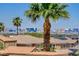 Cityscape view over a neighborhood with palm trees and solar panels at 2388 Kenneth Ave, Henderson, NV 89052