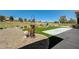 Expansive backyard with lush landscaping, a concrete patio, and views of the golf course at 2625 Youngdale Dr, Las Vegas, NV 89134