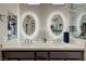 Modern bathroom featuring double sinks with lighted mirrors and updated fixtures at 2625 Youngdale Dr, Las Vegas, NV 89134