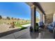 Inviting covered patio with a scenic view of the golf course and community landscaping at 2625 Youngdale Dr, Las Vegas, NV 89134