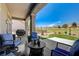 Relaxing covered patio with golf course view and outdoor furniture, perfect for entertaining at 2625 Youngdale Dr, Las Vegas, NV 89134