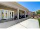 Open covered patio with concrete flooring, exterior lighting, and plush outdoor seating at 2625 Youngdale Dr, Las Vegas, NV 89134