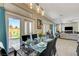 Dining room area with access to backyard, open floor plan, and tile flooring at 2625 Youngdale Dr, Las Vegas, NV 89134