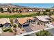 Charming home with desert landscaping and a tile roof is set against a golf course and mountain backdrop at 2625 Youngdale Dr, Las Vegas, NV 89134