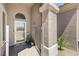 Inviting covered entry featuring a gated courtyard and modern door at 2625 Youngdale Dr, Las Vegas, NV 89134