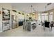 Spacious kitchen featuring a large island, stainless steel appliances, ample storage, and adjacent dining area at 2625 Youngdale Dr, Las Vegas, NV 89134