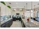 Spacious kitchen with stainless appliances, tile backsplash, and a granite countertop island at 2625 Youngdale Dr, Las Vegas, NV 89134