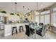 Bright kitchen with a glass dining table, quartz countertops, and stainless steel appliances at 2625 Youngdale Dr, Las Vegas, NV 89134