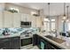 Bright kitchen features stainless steel appliances, tile backsplash, and granite countertops at 2625 Youngdale Dr, Las Vegas, NV 89134