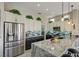 Stylish kitchen featuring a granite island, stainless steel appliances, and custom cabinets with lots of storage at 2625 Youngdale Dr, Las Vegas, NV 89134