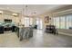 Bright kitchen features an island with granite countertop, stainless appliances, and bar at 2625 Youngdale Dr, Las Vegas, NV 89134