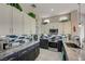 Well-lit kitchen with stainless steel appliances, two-toned cabinetry, and blue accent tiles at 2625 Youngdale Dr, Las Vegas, NV 89134