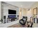 Comfortable living room featuring a decorative wall, modern decor and foyer access at 2625 Youngdale Dr, Las Vegas, NV 89134