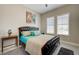 Cozy main bedroom with dark wood accents, complemented by bright turquoise accents and soft natural light at 2625 Youngdale Dr, Las Vegas, NV 89134