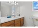 Well-appointed bathroom featuring a spacious vanity, sink, and a bright window at 2633 Chin Cactus Ct, Las Vegas, NV 89106