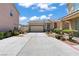 Charming single-story home showcasing a private driveway, two car garage, and inviting curb appeal at 2633 Chin Cactus Ct, Las Vegas, NV 89106