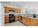 Well-equipped kitchen with stainless steel appliances, granite countertops, and light wood cabinets at 2633 Chin Cactus Ct, Las Vegas, NV 89106
