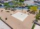Overhead view of a park with a basketball court, seating, and green spaces in the community at 2633 Chin Cactus Ct, Las Vegas, NV 89106