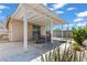 Covered patio with outdoor seating, ideal for dining and relaxing in a private backyard setting at 2633 Chin Cactus Ct, Las Vegas, NV 89106