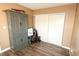 Bedroom with hardwood flooring, neutral walls, and a double sliding-door closet and cabinet at 2722 Sweet Basil Dr, Las Vegas, NV 89142
