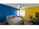This bedroom offers natural light, neutral carpet, and a modern ceiling fan at 2722 Sweet Basil Dr, Las Vegas, NV 89142