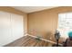 Bedroom with hardwood flooring, neutral walls, and double sliding-door closet at 2722 Sweet Basil Dr, Las Vegas, NV 89142