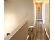 Inviting hallway with wood laminate flooring, neutral paint, and a view of the home's interior at 2722 Sweet Basil Dr, Las Vegas, NV 89142